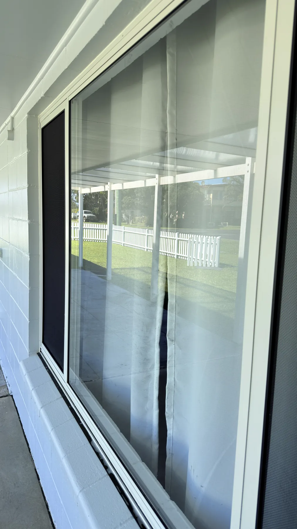 Clean exterior window glass with a clear reflection after window cleaning by Be Clean Exteriors